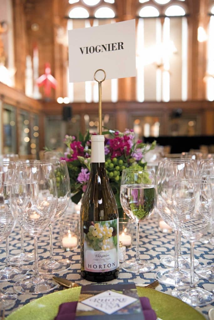 Photo of Horton Vineyards' Viognier bottle and wine glasses on a table