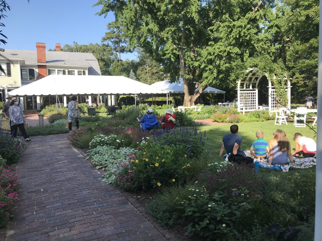 People sitting outdoors at Lewis Ginter Botanical Garden