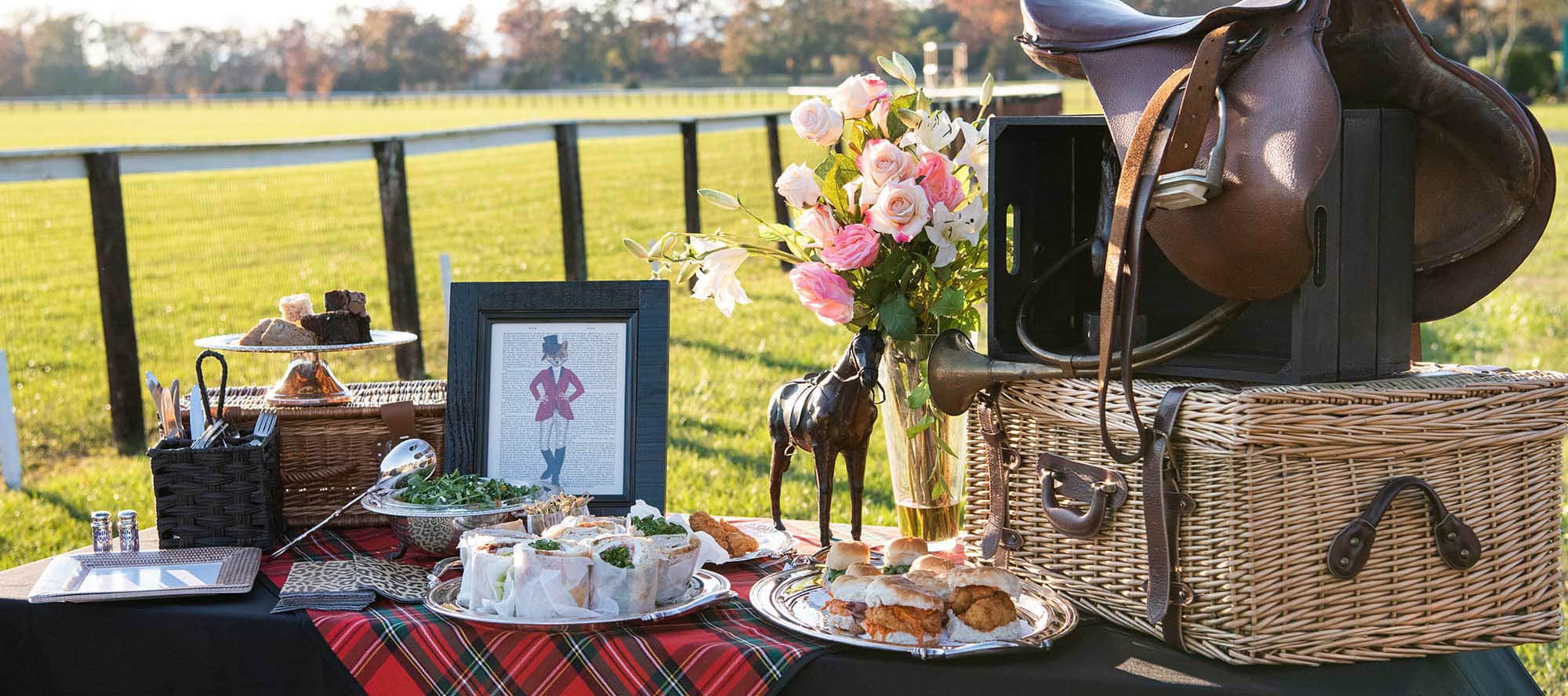 A tailgate spread at Foxfield Races with equestrian touches, silver and fresh flowers, Image by © R.L. Johnson for Wine & Country Life