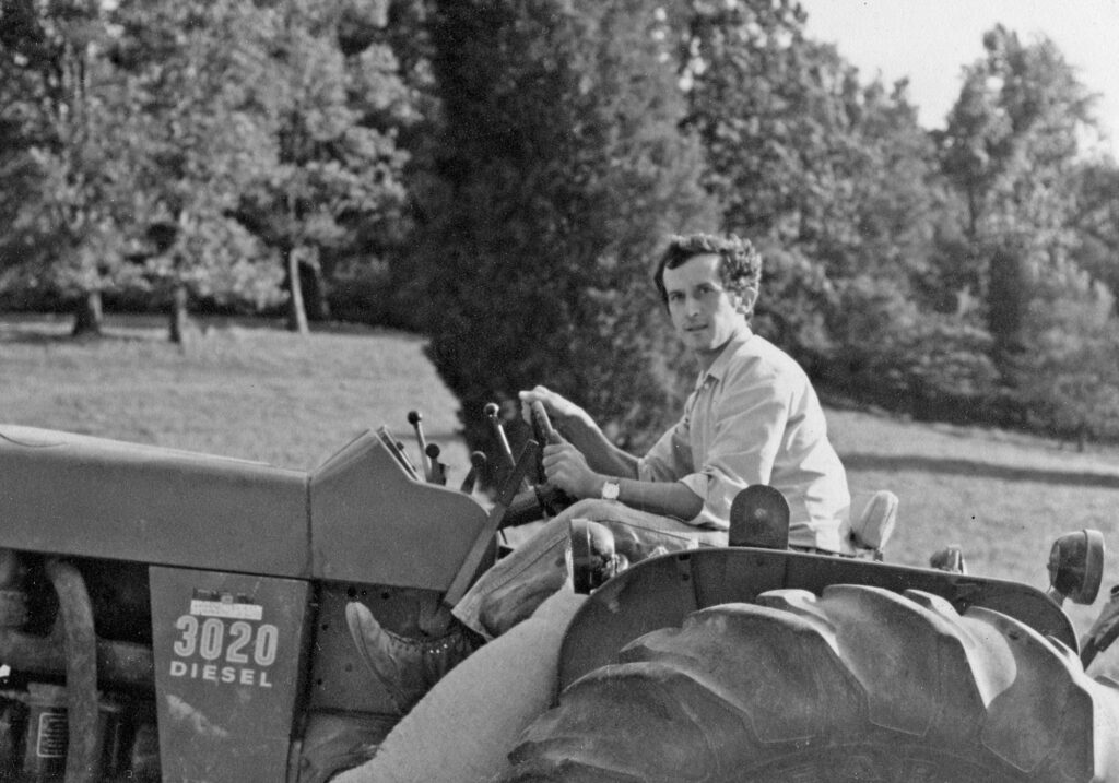 A young Gabriele Rausse driving the tractor at the vineyard, vintage Image by © Gabriele Rausse Winery