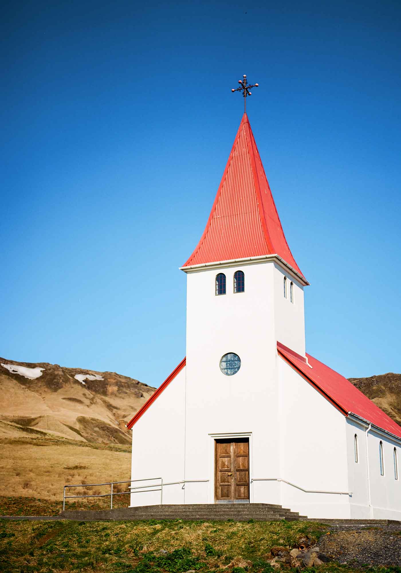 Classic Red Steepled Church in Vík í Mýrdal Village in Iceland