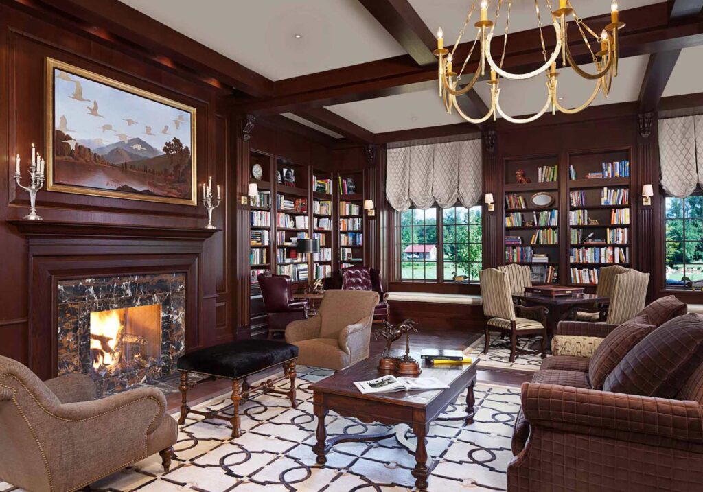 The wood paneled guest library with fireplace and equestrian rug at the luxury Salamander Resort & Spa in Middleburg, Va