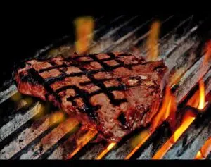 Photo of a steak on the grill at Aberdeen Barn