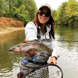 Photo of woman fly fishing