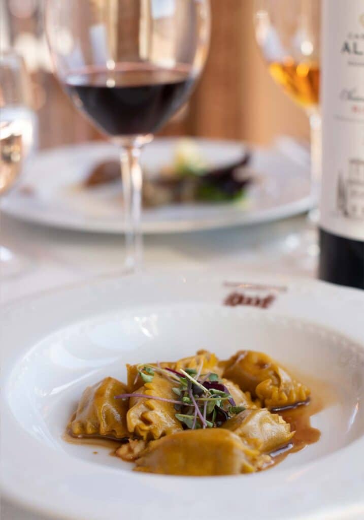 Chefs prepared delicate flavors in a ravioli dish paired with Castello Di Albola red wine for the Tuscan Feast at Barboursville Vineyards.