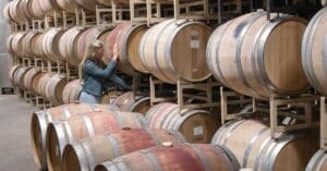 Emily Hodson, Veritas Winery & Vineyards Winemaker working in the barrel room. Monticello AVA near Charlottesville, VA