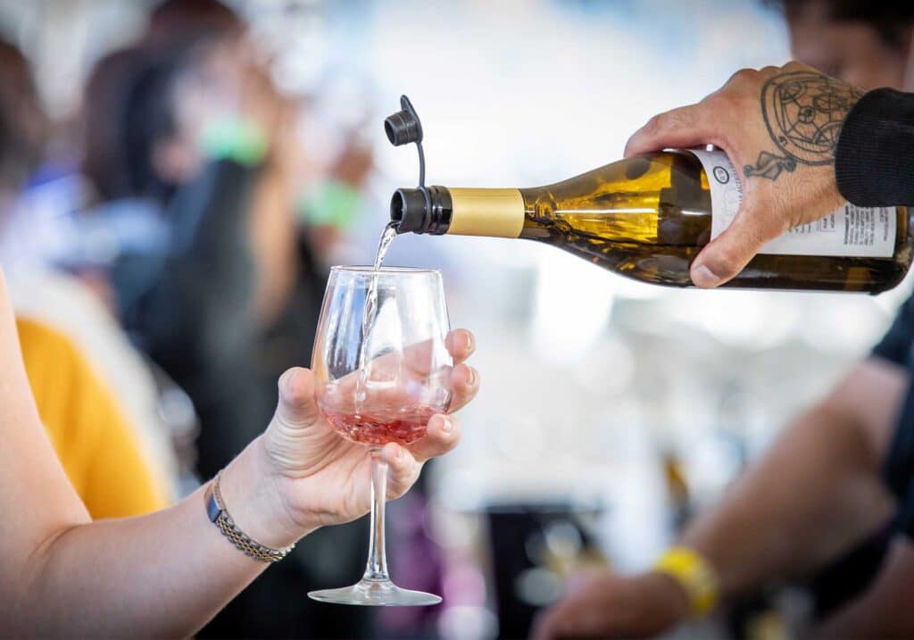 People sample wine from Starburn Winery at the United Bank Bloomin' Wine  Festival on Friday April 28, 2017 in Winchester, Va.. The wine festival,  which continues on Saturday, officially kicked-off the start