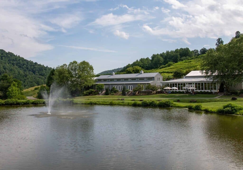 Photo of building and lake at Mountain & Vine Vineyards in Virginia