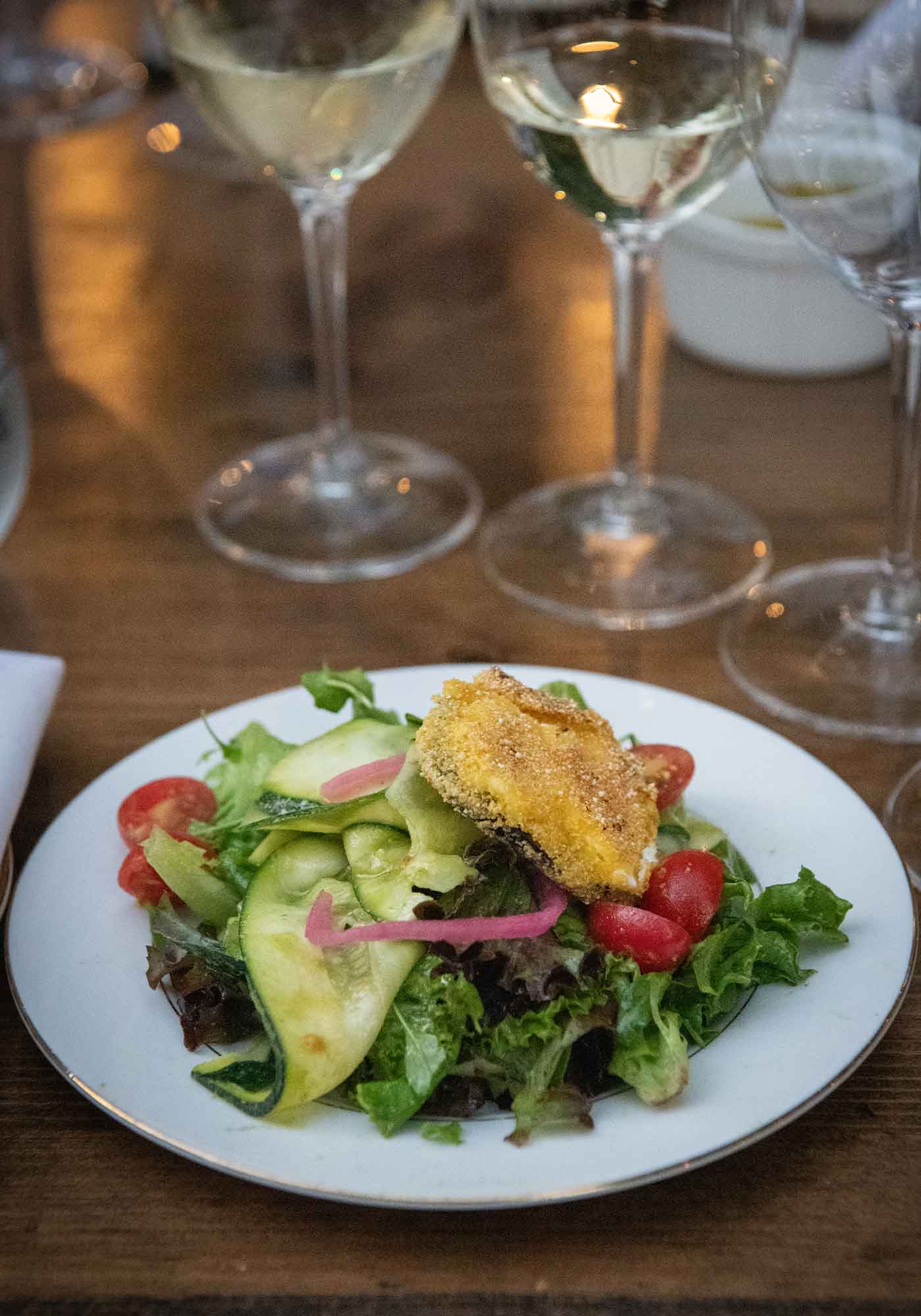 Late summer salad with Caromont Farm goat cheese medallion prepared by Chef Vincent Derquenne and Chef Travis Burton served at Shaps Winery. french winemakers in virginia and virginia wine in france