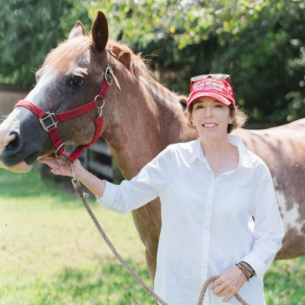 artist Martha Strawther with a horse