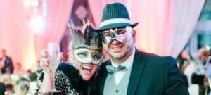 Veritas New Years Eve Ball, couple wearing masks