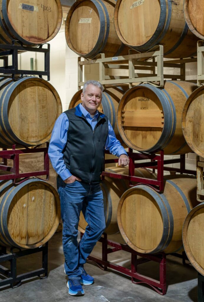 Photo of winemaker Bryan Jones in the barrel room at Prince Michel Winery