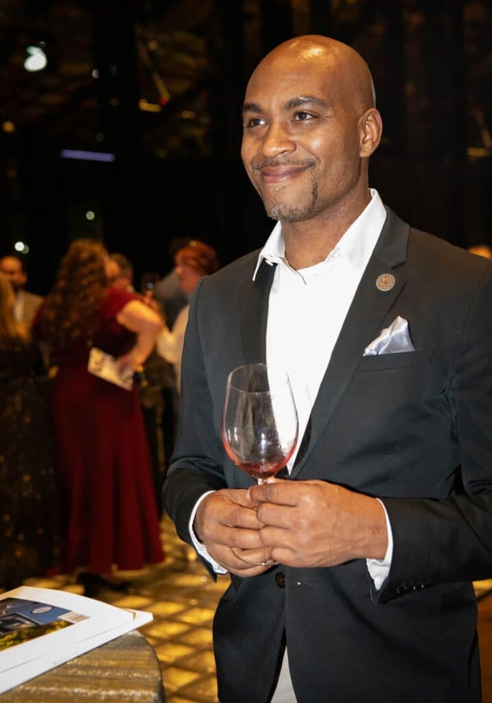 Photo of Titus Green, sommelier and wine judge, celebrates the best of Virginia wines 2024.