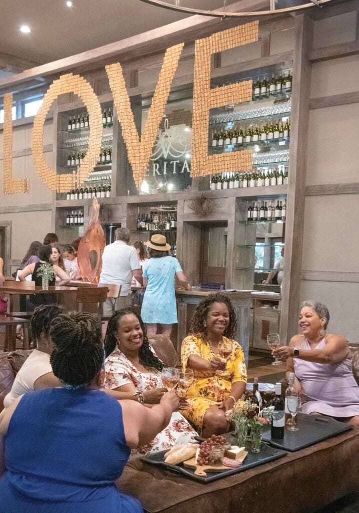 Women at Veritas enjoying wine.