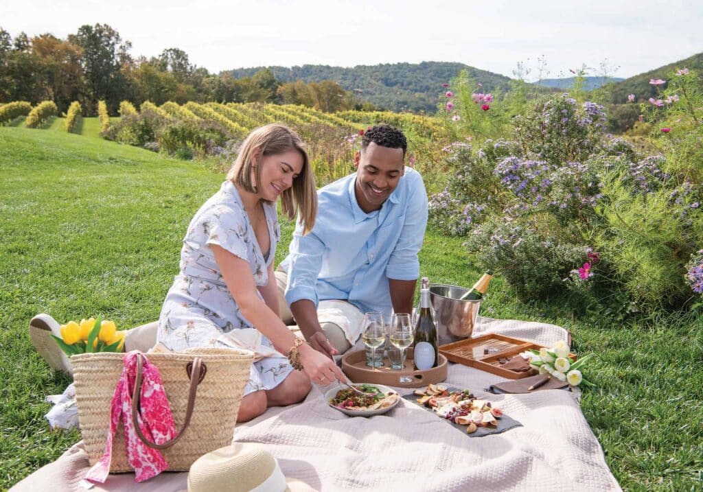 Two people picnicking at Pippin Hill, Mark and Chloe.