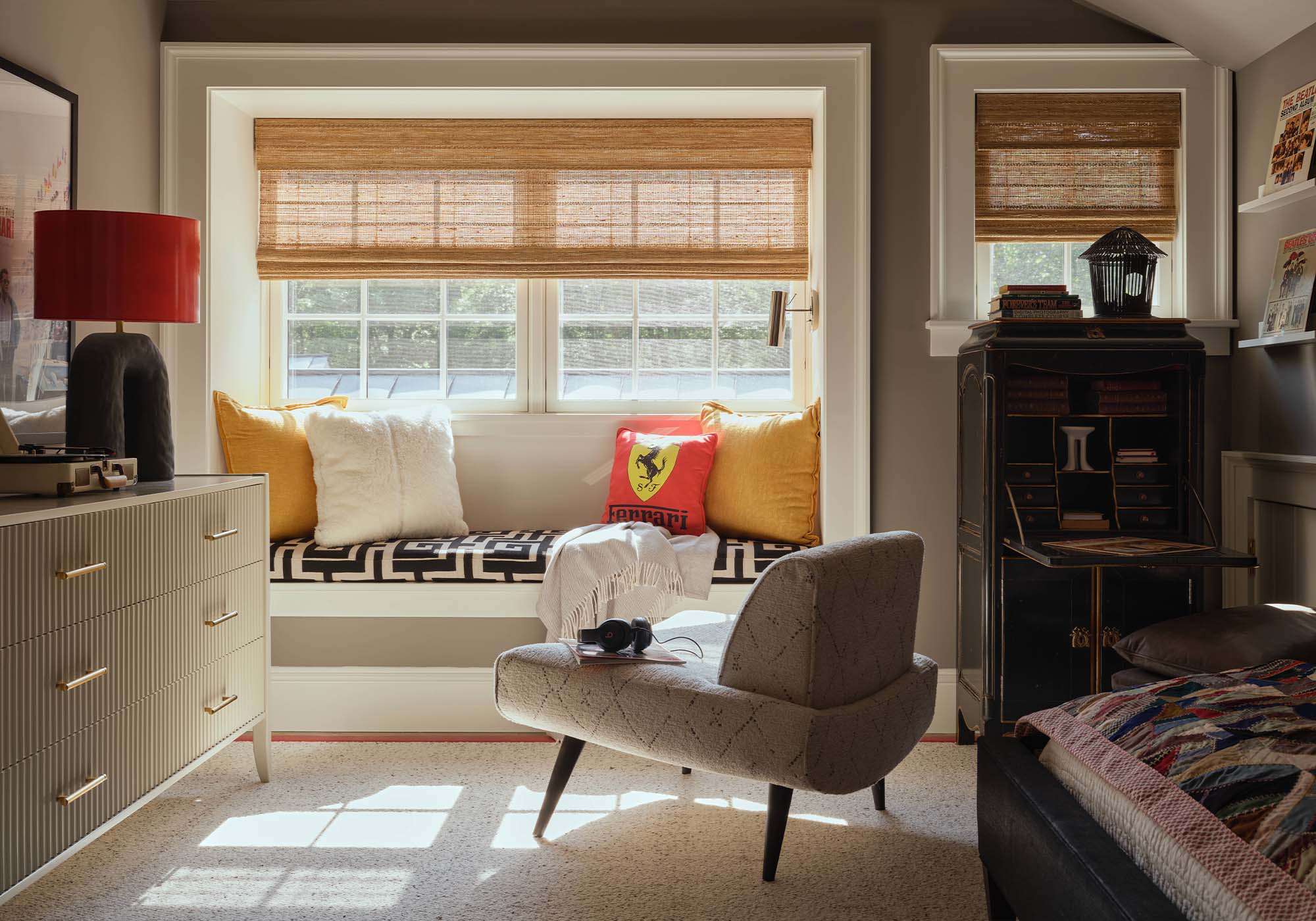 Neutral-toned boy’s bedroom in the 2025 Southern Living Idea House by Charlotte Moss, with Sherwin-Williams Dovetail-gray walls, white bedding, and leather ottoman.