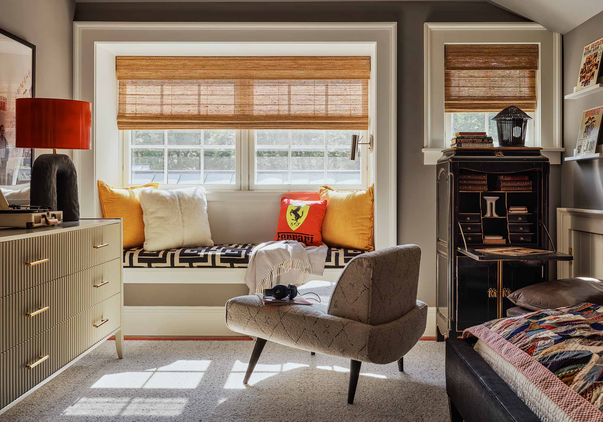 Neutral-toned boy’s bedroom in the 2025 Southern Living Idea House by Charlotte Moss, with Sherwin-Williams Dovetail-gray walls, white bedding, and leather ottoman.