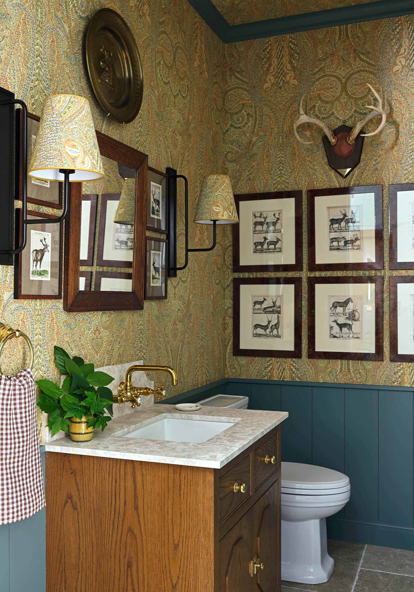 Boot room powder room in the 2025 Southern Living Idea House by Charlotte Moss, featuring Nevis plaid accents, built-in storage, and a charming, functional design.
