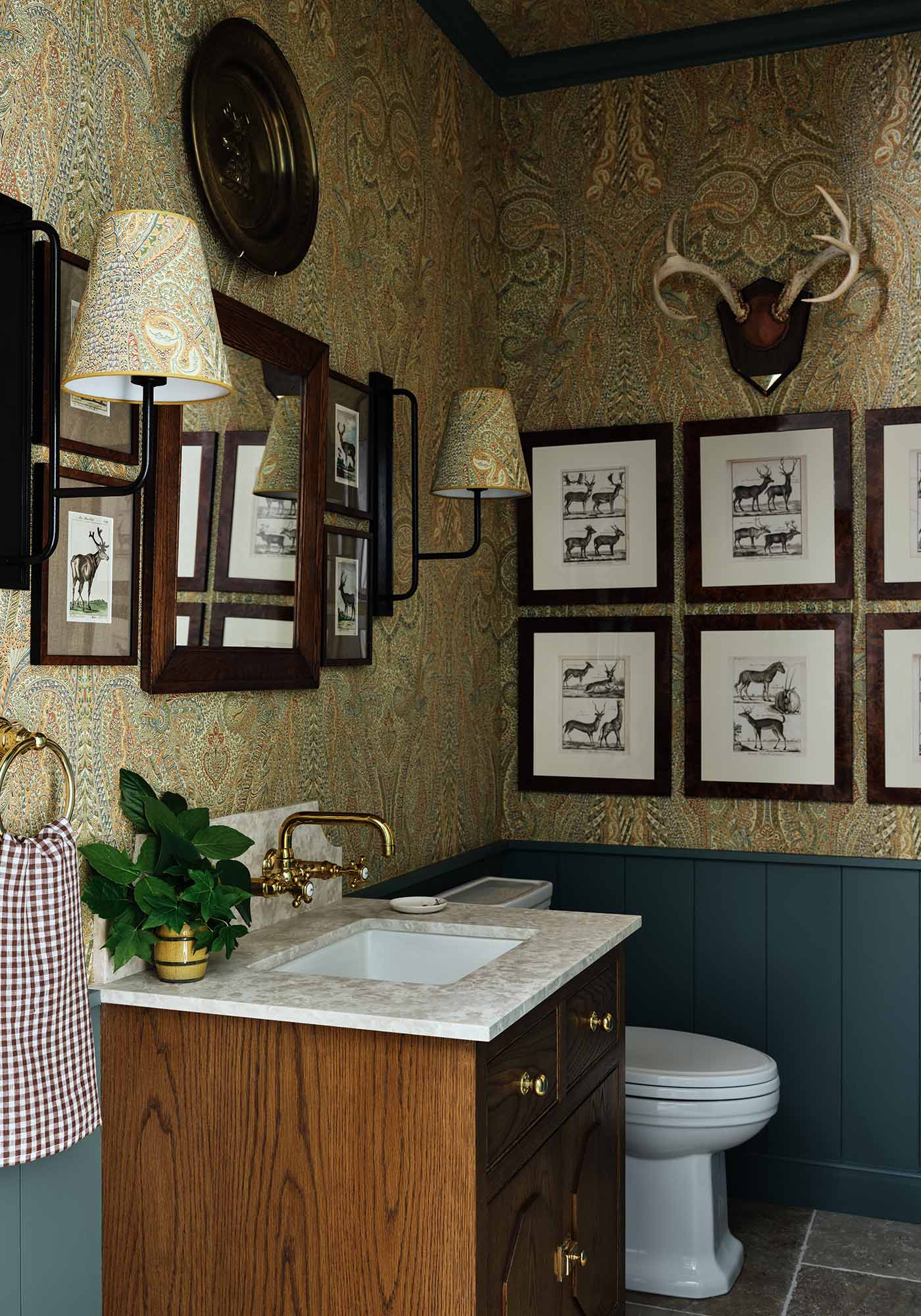 Boot room powder room in the 2025 Southern Living Idea House by Charlotte Moss, featuring Nevis plaid accents, built-in storage, and a charming, functional design.