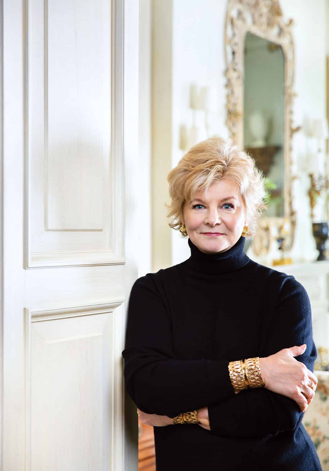 Headshot of Charlotte Moss, designer of the 2025 Southern Living Idea House, smiling and posed in a bright, elegant setting.