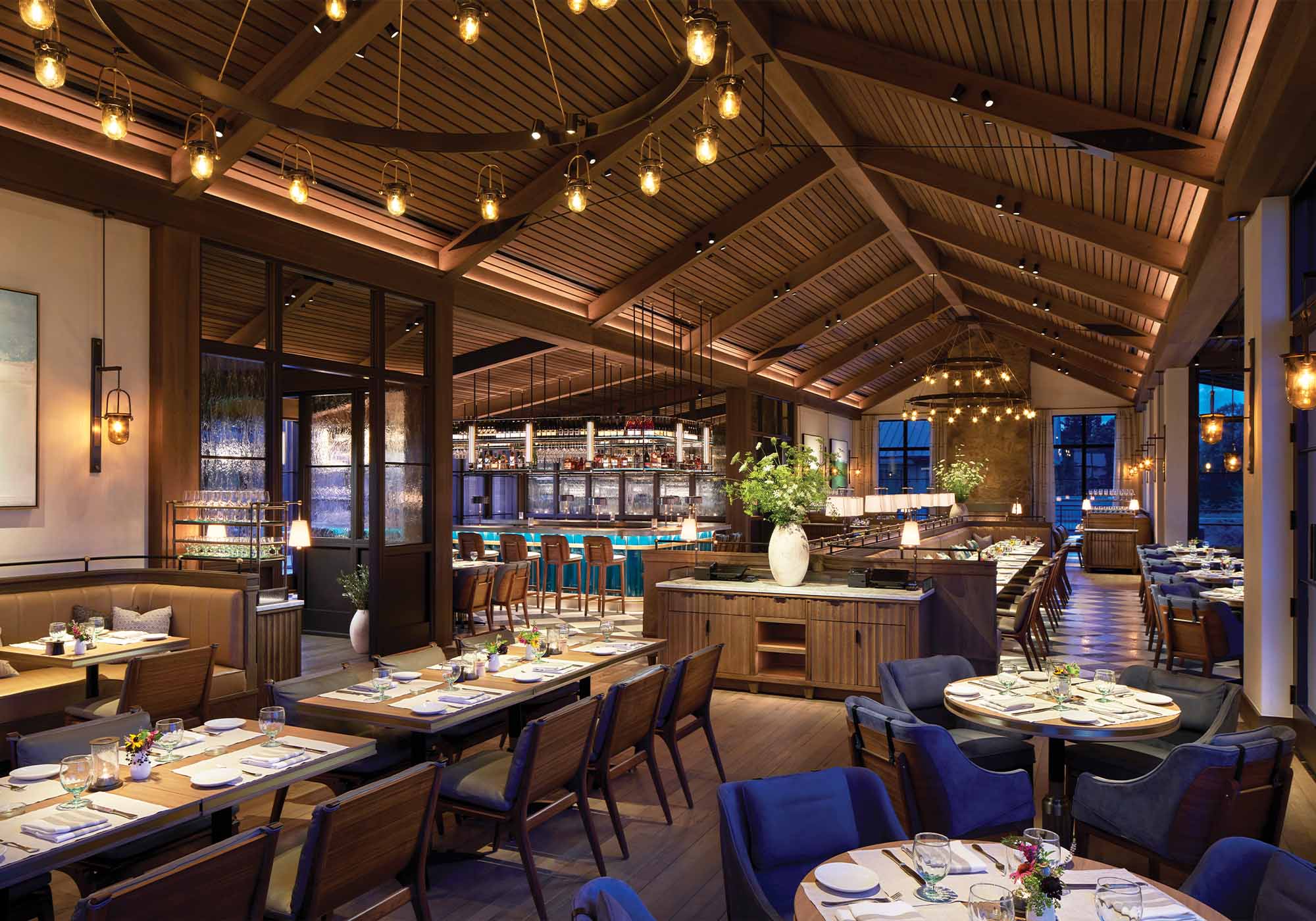 Interior of Marigold Restaurant at Keswick Hall in Keswick, Virginia, featuring elegant dining tables, warm lighting, and a sophisticated atmosphere near the 2025 Southern Living Idea House.