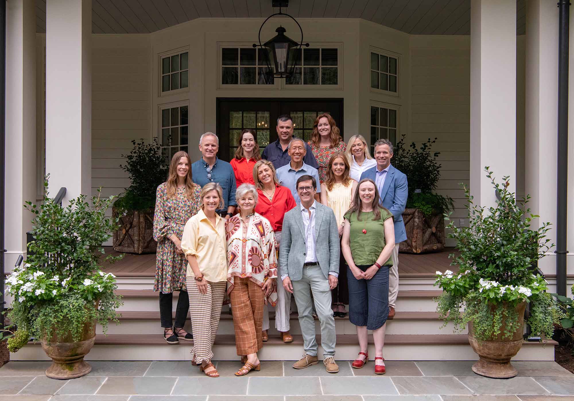 The design and construction team behind the 2025 Southern Living Idea House, including Charlotte Moss and key collaborators, posing together on-site in Keswick, Virginia.