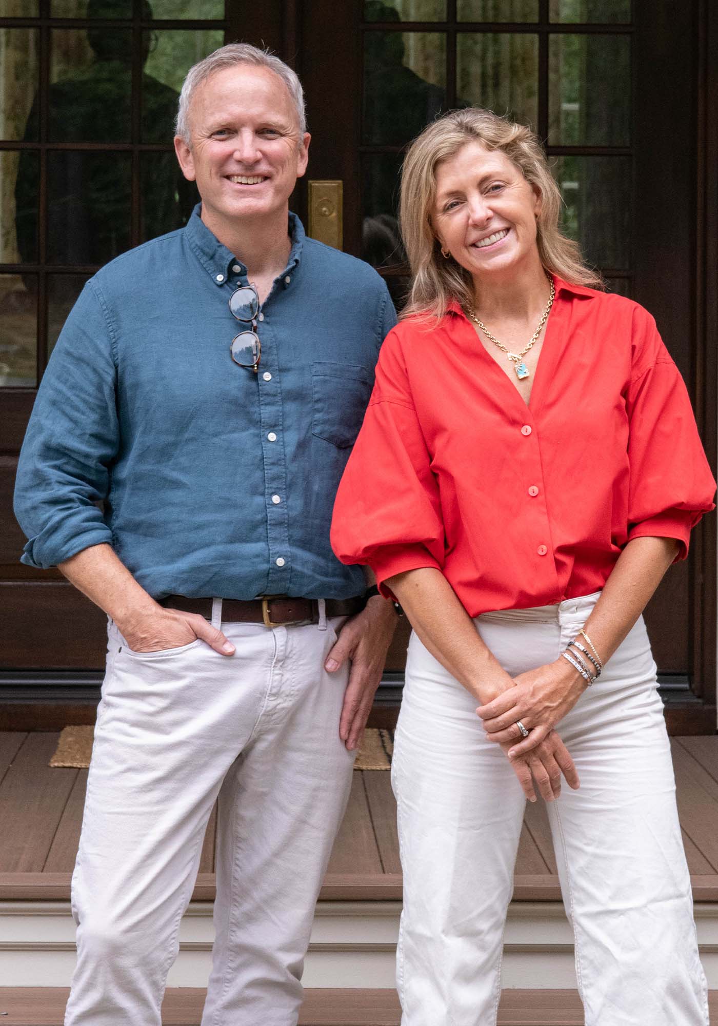 Architects Keith Scott and Julie Kline Dixon from Rosney Co. of the 2025 Southern Living Idea House, posing together on-site in Keswick, Virginia, showcasing the team responsible for the home's design and structure.