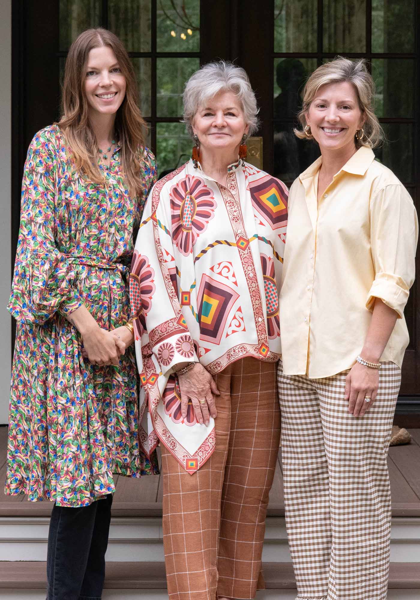 Headshot of Charlotte Moss with two collaborators, the trio behind the 2025 Southern Living Idea House, posed together in a bright, elegant setting.
