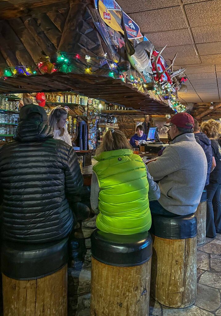 Rustic lodge-style interior of Bart & Yeti’s in Vail Village, Colorado, with a lively après-ski atmosphere.
