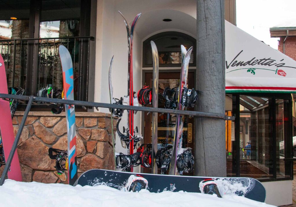 Exterior view of Vendetta’s restaurant in Vail Village, Colorado, with Alpine-style architecture and snow-covered surroundings.