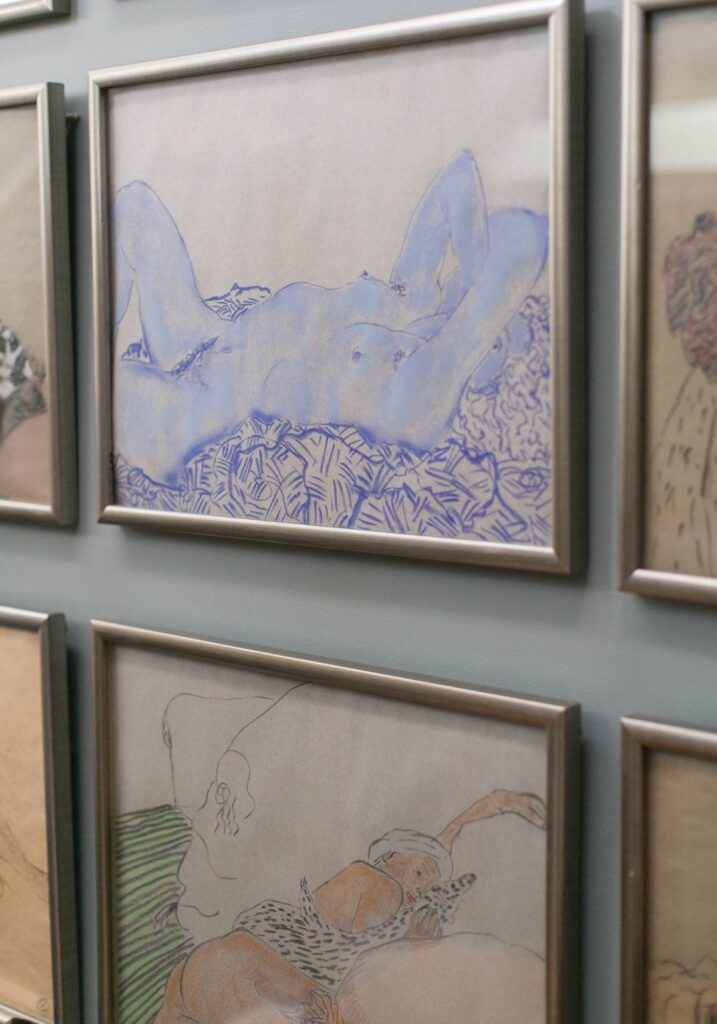 Charlottesville Artist Beatrix Ost's paintings on the wall.