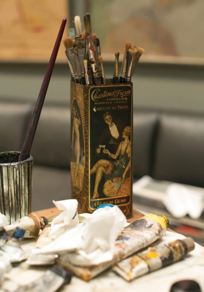 Paintbrushes and oil paint in a French 1920s tin used by Beatrix Ost in her Charlottesville studio
