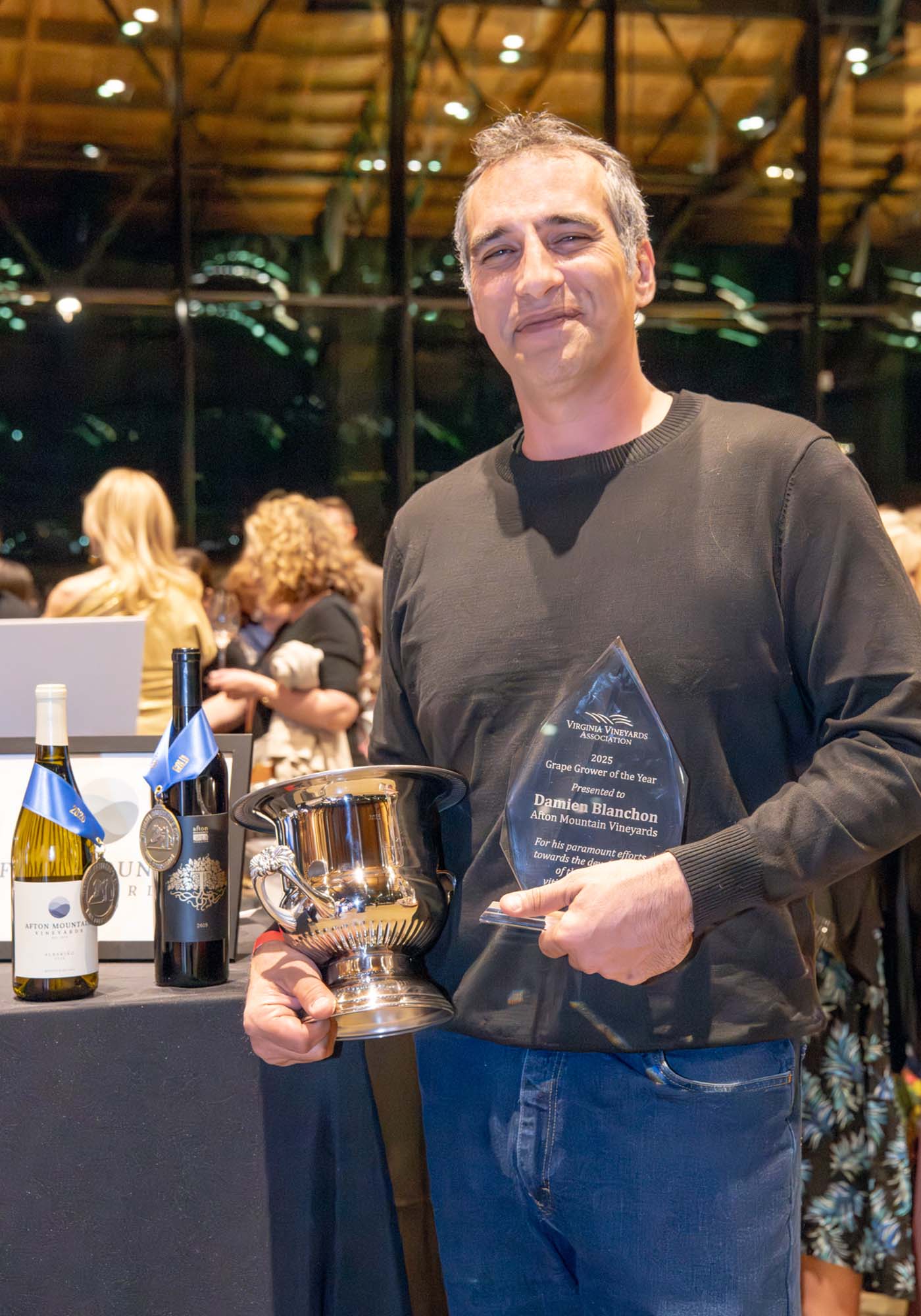 Damien Blanchon with plaque and award after winning Grape Grower of the Year