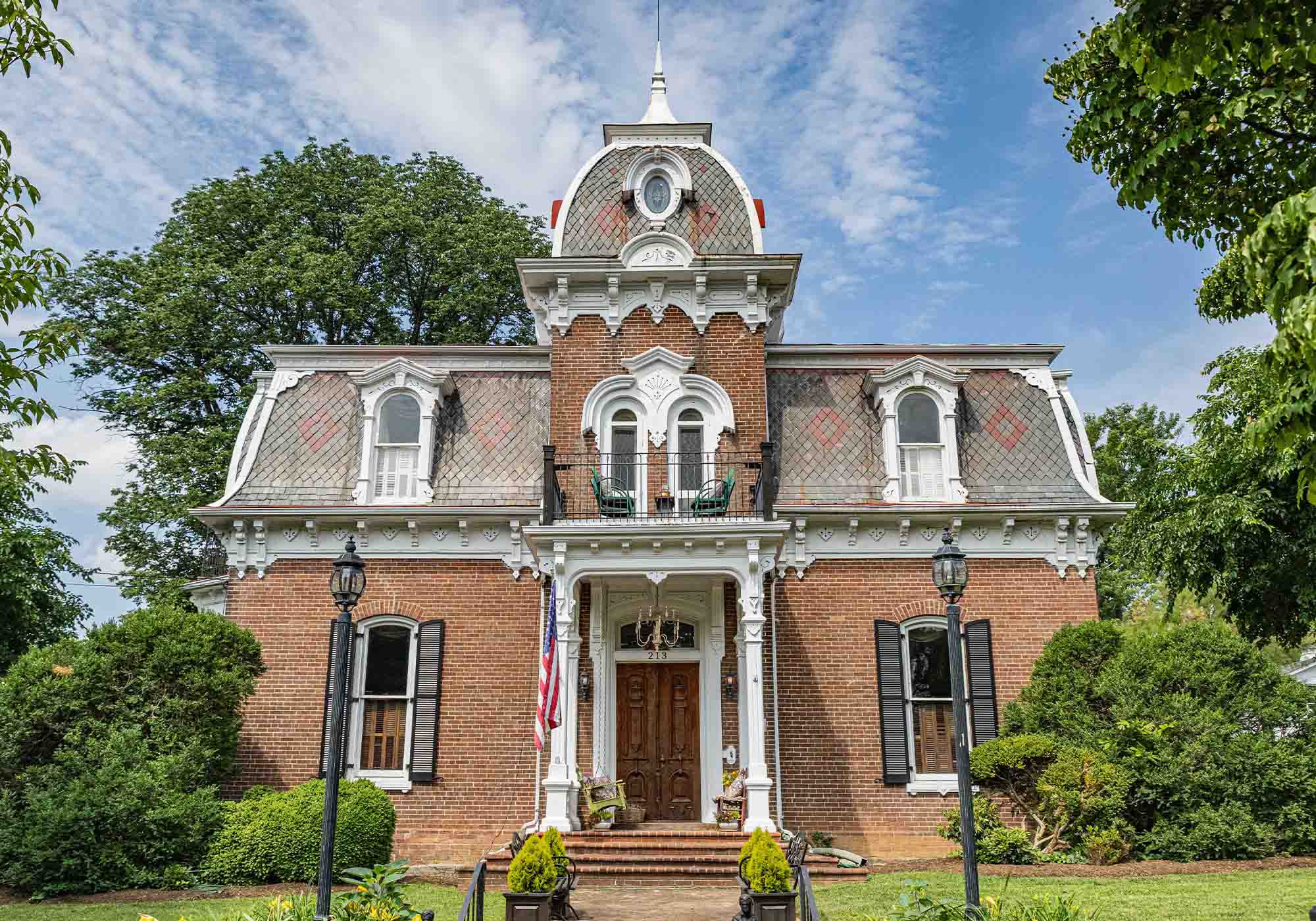 Evans-Webber House in Salem, Virginia with red patterned tile roof and grand wooden doors featured on the 2026 Historic Garden Week tour