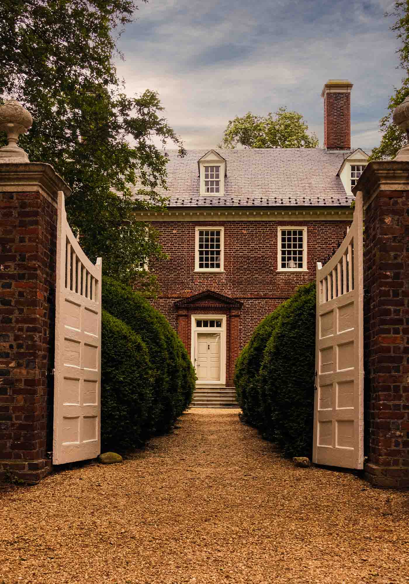 Historic Berkeley Plantation gravel path and garden gate leading to the main house during 2026 Historic Garden Week