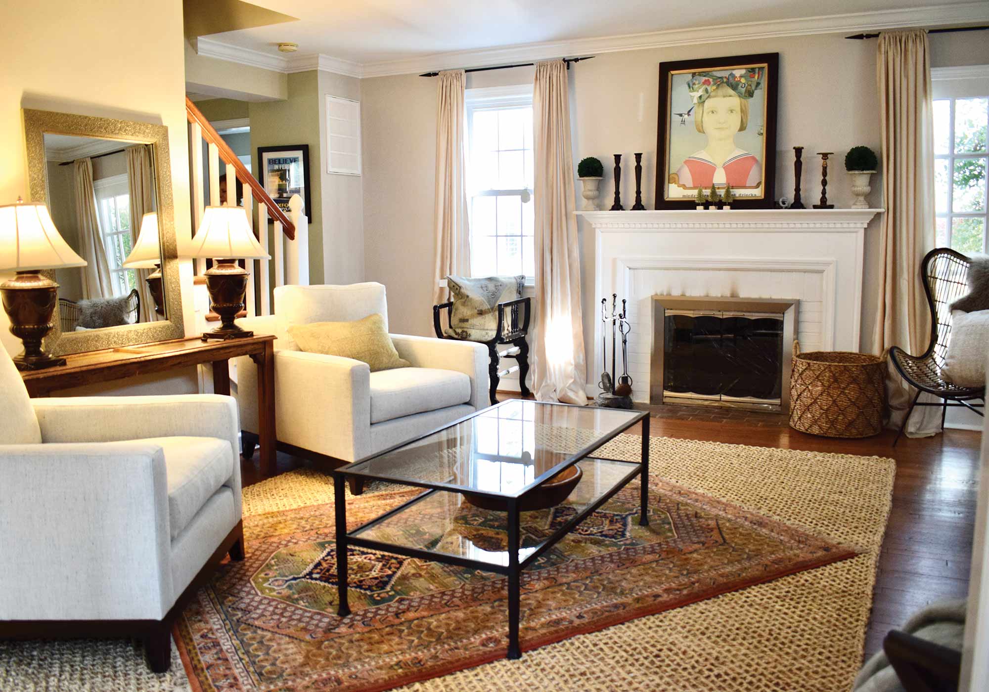stylish living room with chairs, fireplace and a coffee table.