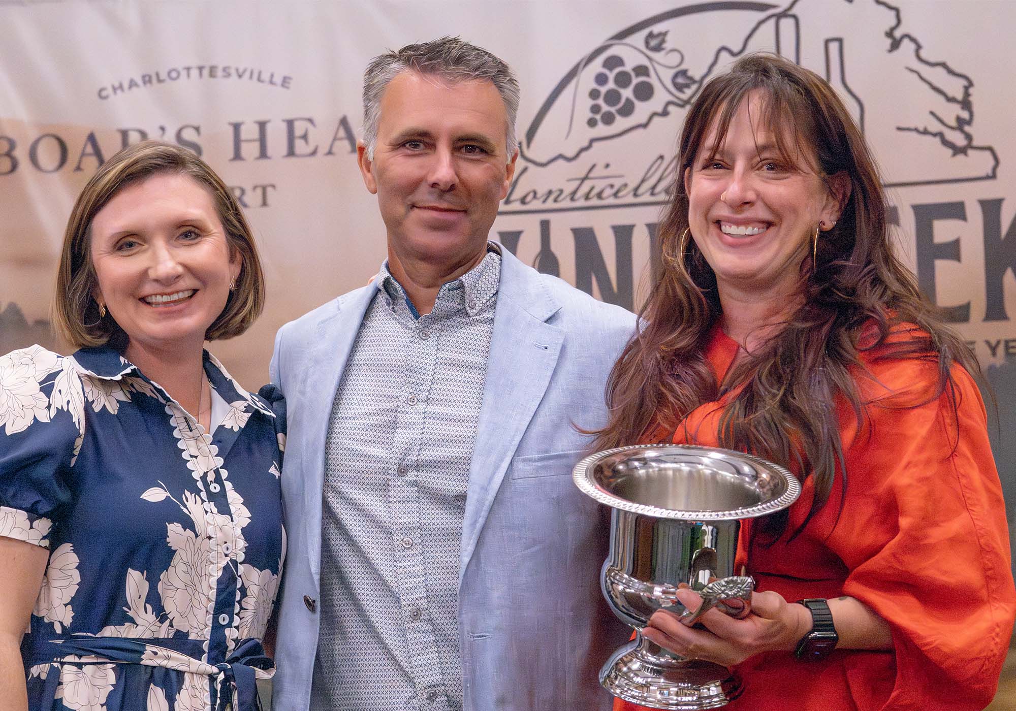 AJ Greely of Hark Vineyards celebrates winning the 2026 Monticello Cup alongside Virginia Secretary of Agriculture Katie Frazier and wine judge Frank Morgan.