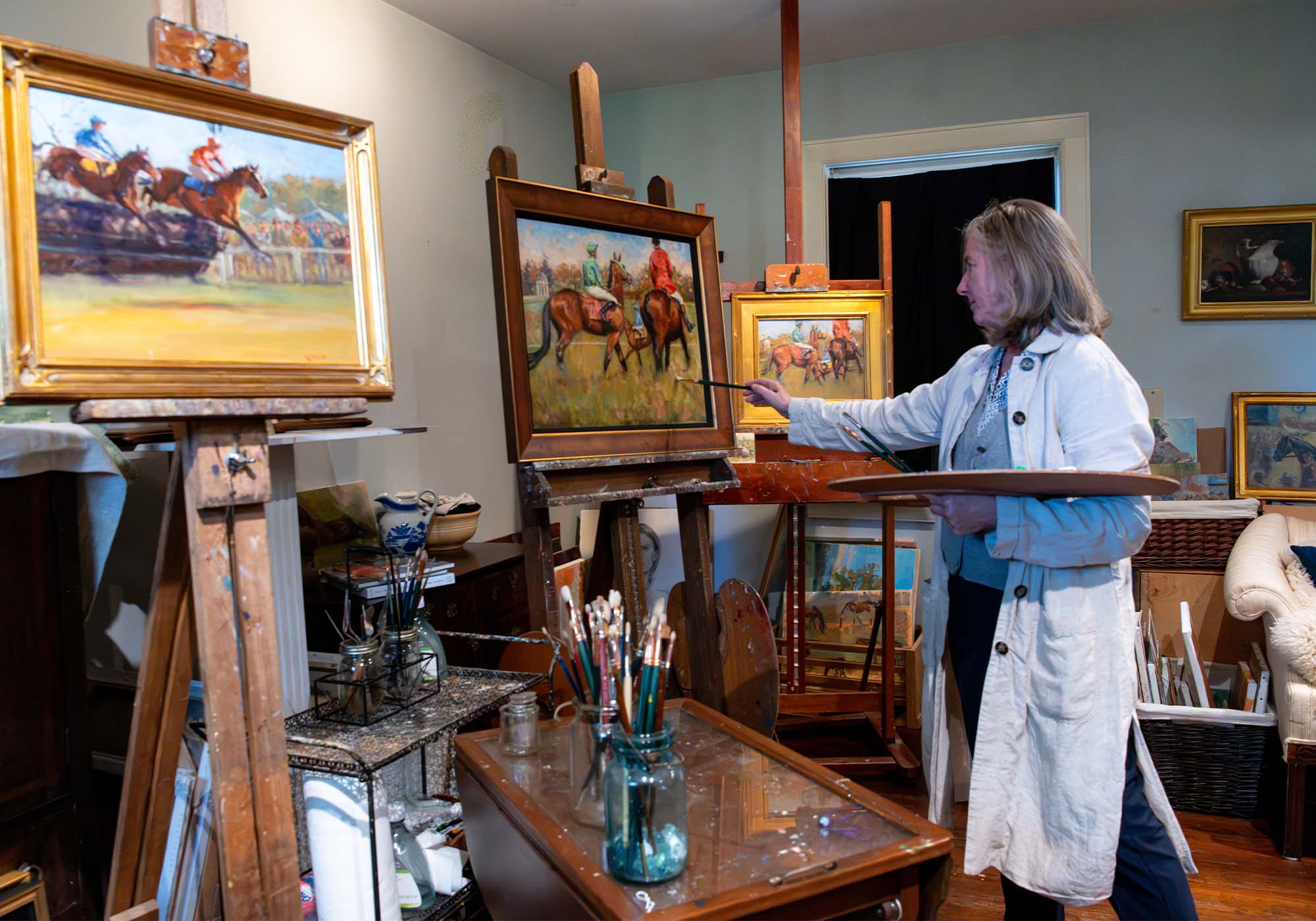 Virginia artist Kelly Wilkinson Coffin working on a painting in her Virginia studio